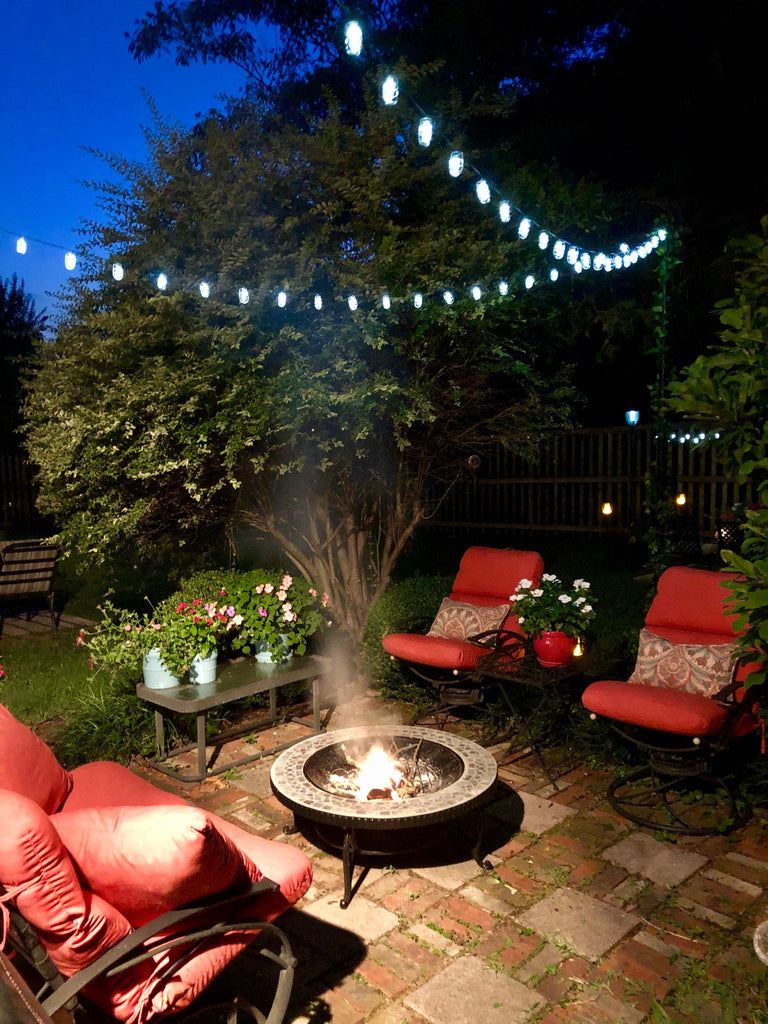 String lights over outdoor fire pit