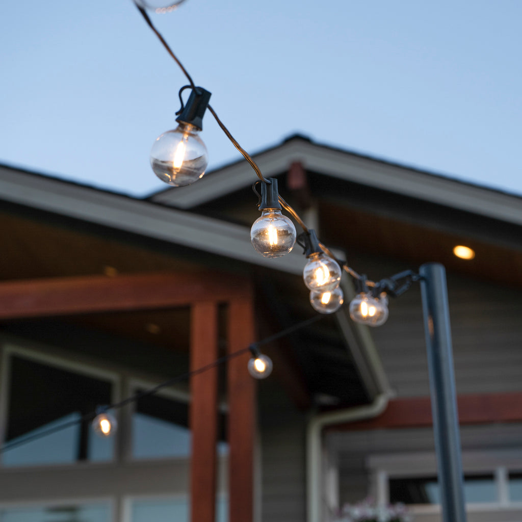 String light bulbs shown in between poles
