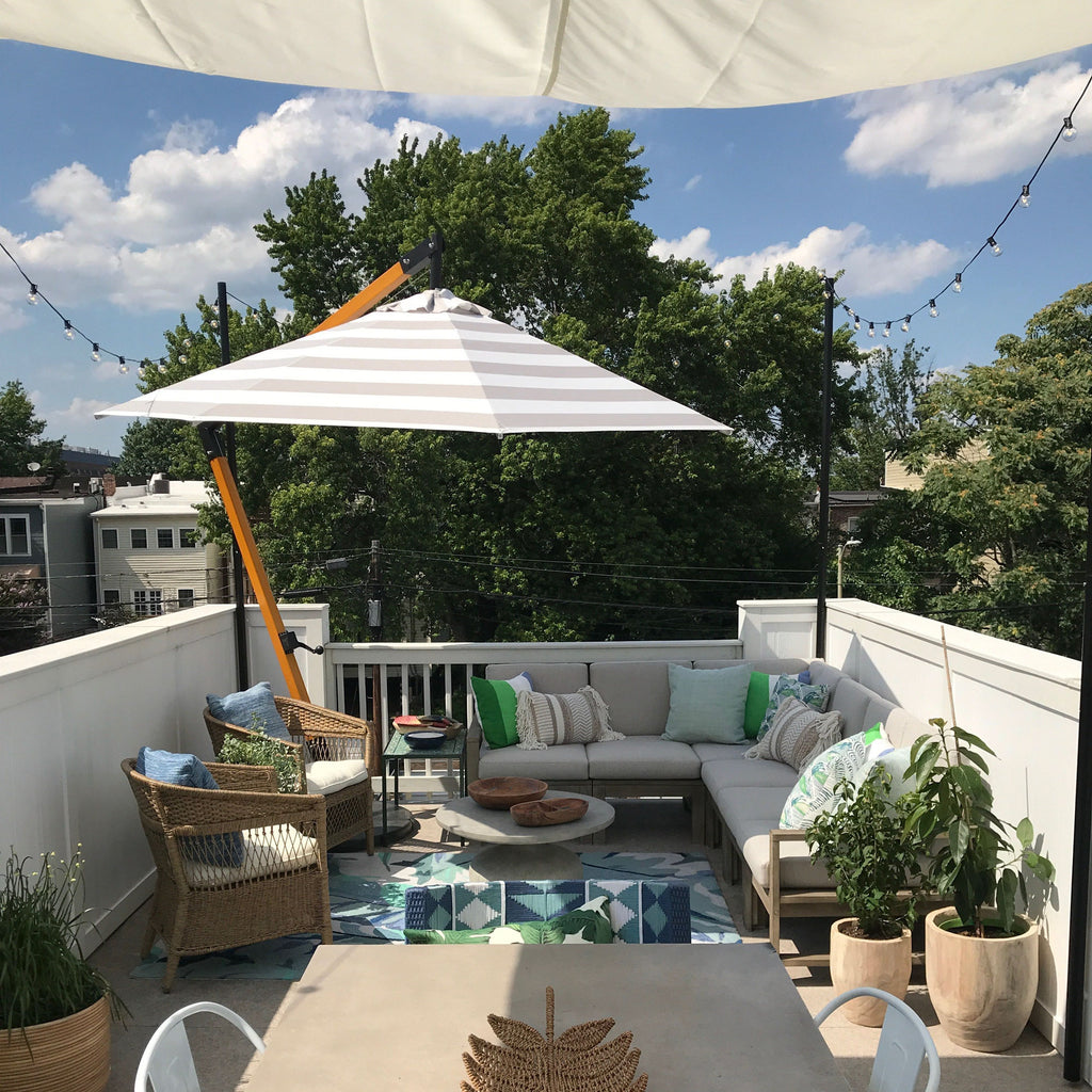 Rooftop deck with furniture and string lights